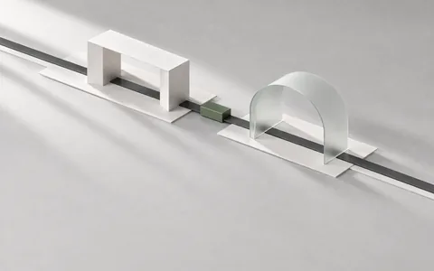 Two interchangeable architectural modules on a continuous track, illustrating model choice within a session.