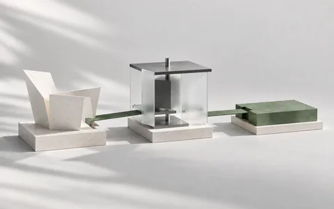Three architectural objects arranged in a linear sequence, connected by a narrow green strip.